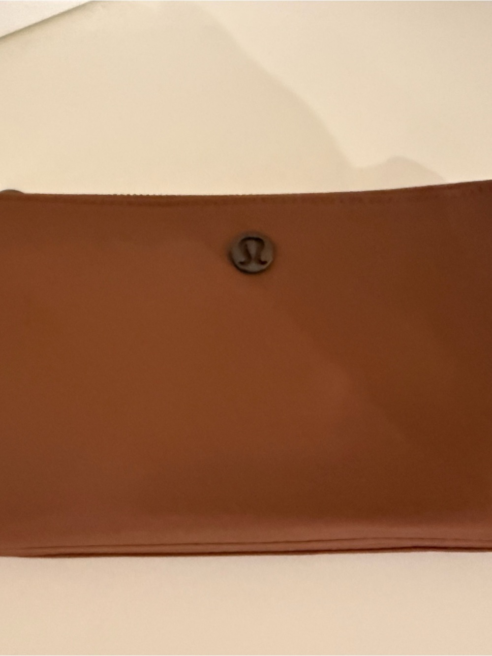 Lululemon wallet phone holder clutch in a rich brown/cognac color
